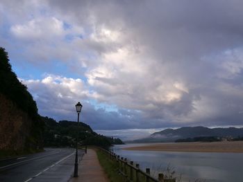 View of road against cloudy sky