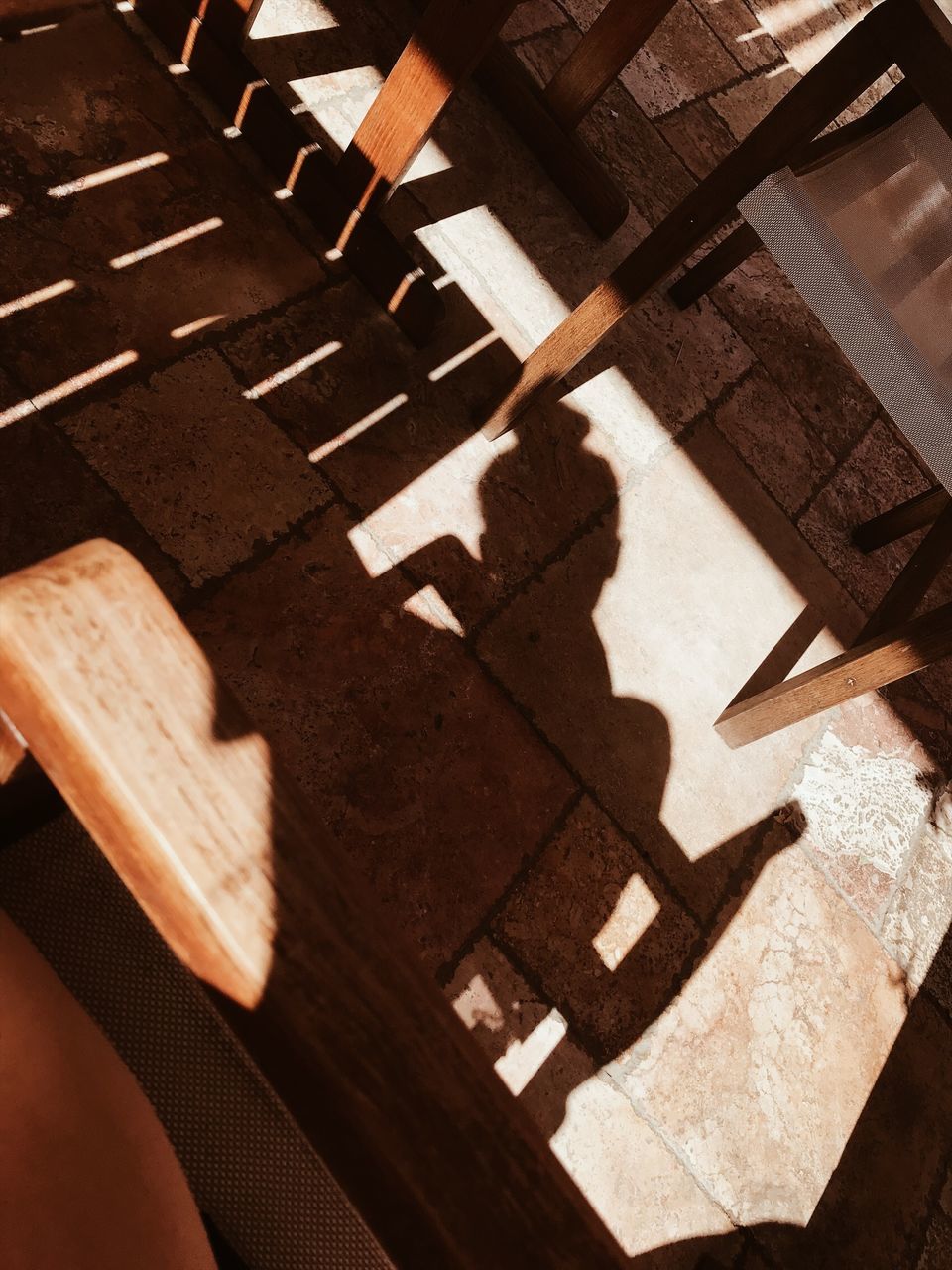 shadow, high angle view, sunlight, no people, day, wood - material, nature, indoors, focus on shadow, pattern, close-up, architecture, still life, built structure, railing, sunny, human representation