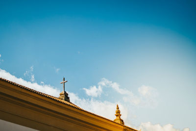 Low angle view of statue against blue sky