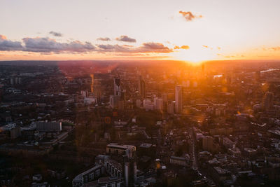 High angle view of buildings against sky during sunset