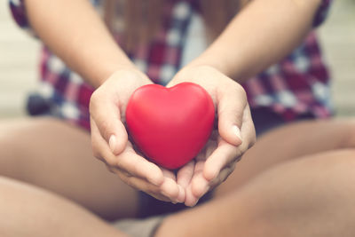 Close-up of hands holding heart shape