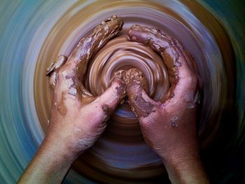 Cropped image of potter making pottery