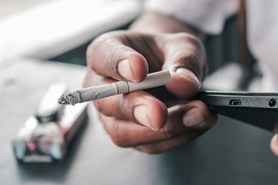 Hand holding cigarette