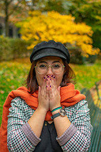 Portrait of young woman wearing hat