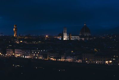 Illuminated buildings in city at night