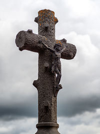 Low angle view of statue against sky