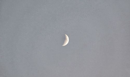 Low angle view of moon against clear sky