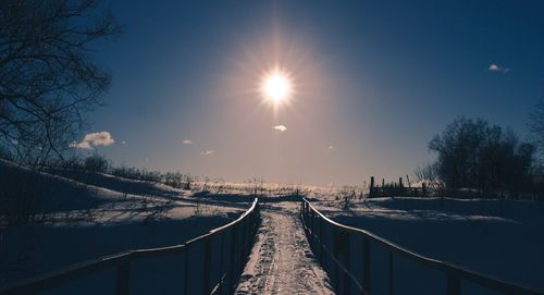 Panoramic view of snow covered trees against sky