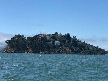 Scenic view of sea against blue sky