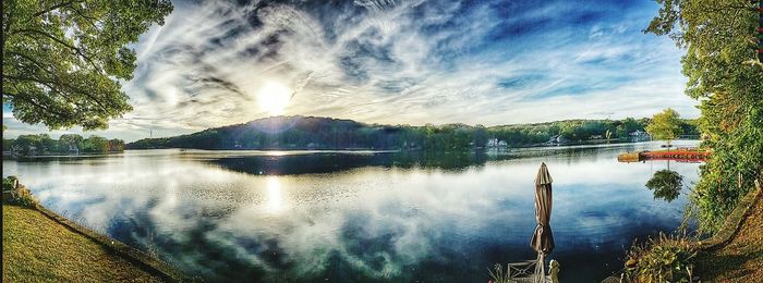 Scenic view of lake against cloudy sky