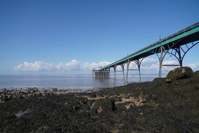 Bridge over sea against sky