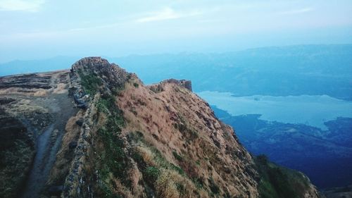 Scenic view of mountains and sea against sky