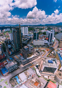 High angle view of modern buildings in city against sky