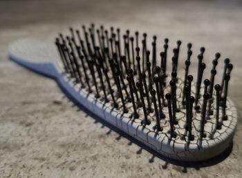 Close-up of a comb on table