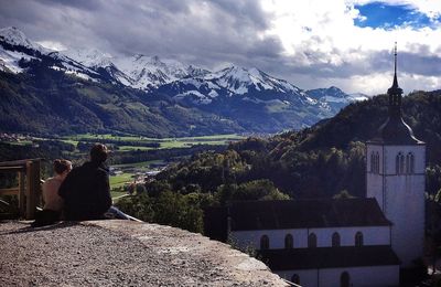 Scenic view of mountains against cloudy sky