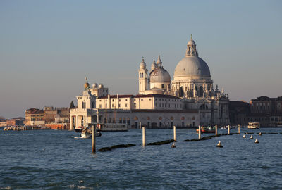 View of church in city against clear sky