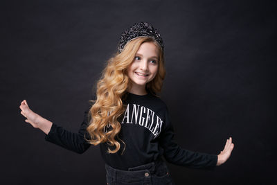 Little funny cute birthday girl, princess 10 years old, wears dark clothes