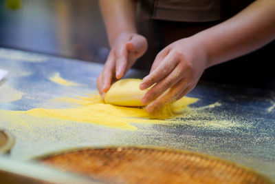 Close-up of person preparing food