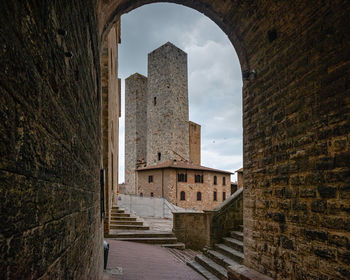 View of old building against cloudy sky