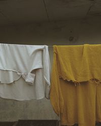 Clothes drying on wall at home