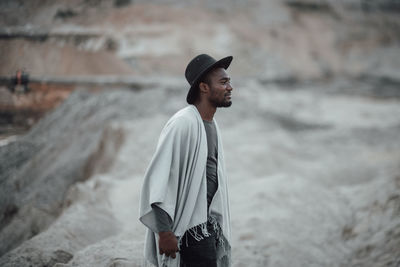 Side view of young man looking away