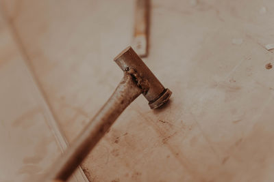 Close-up of rusty metal on table