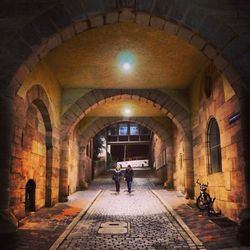 People walking in tunnel