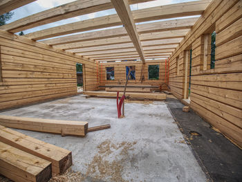 Wooden timber building, house under construction. construction of modern house from wood beams. 