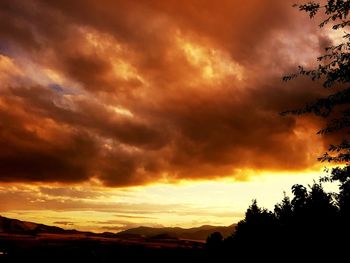 Scenic view of dramatic sky during sunset