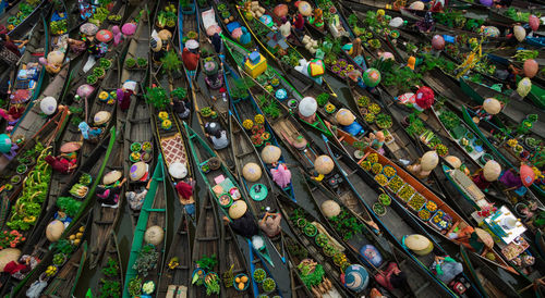Full frame shot of people selling fruits and vegetables on boats in river