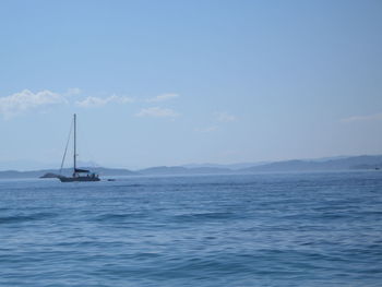 Boat in sea against blue sky