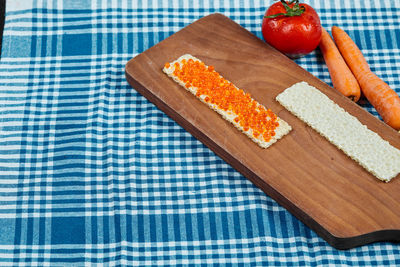 High angle view of fruits on cutting board