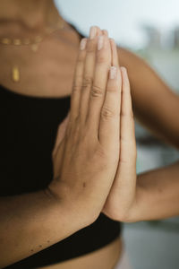 Low section of woman massaging customer