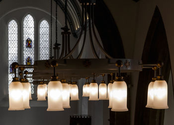 Illuminated chandelier in church