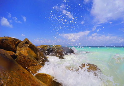 Scenic view of sea against blue sky