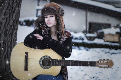 Portrait of a young woman in snow