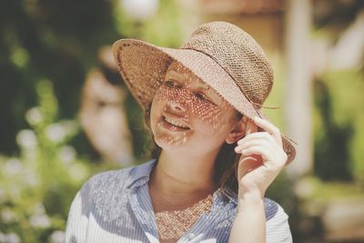 Portrait of woman wearing hat
