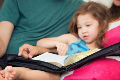 Cute girl holding book