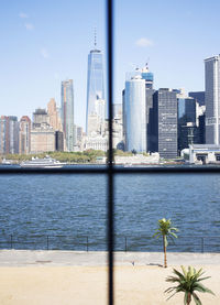 Buildings in city against blue sky