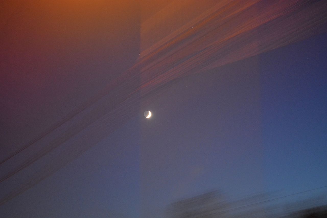 LOW ANGLE VIEW OF MOON AT NIGHT