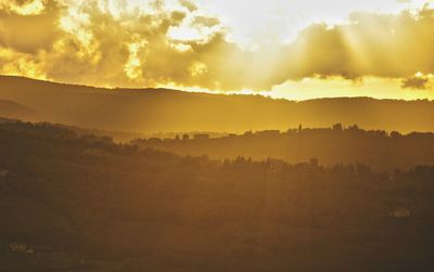 Scenic view of landscape against sky during sunset