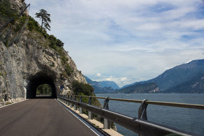 Bridge over mountains against sky