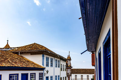 Facade of old colorful colonial houses and church in the historic town of diamantina