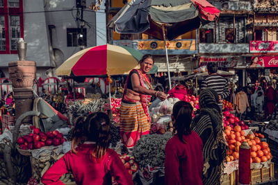 People at market stall