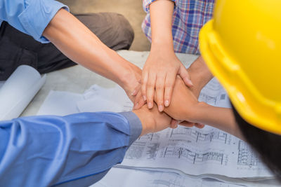 Low section of people with hands