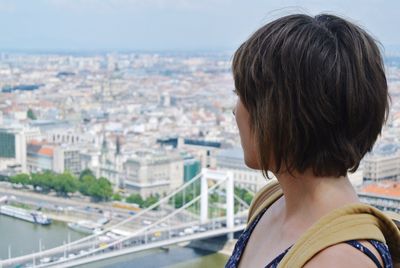 Close-up of woman looking at cityscape