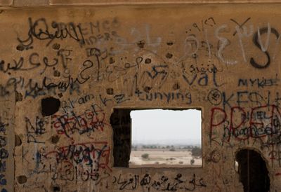 Graffiti on wall of old building