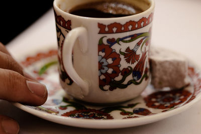 Close-up of coffee cup on table