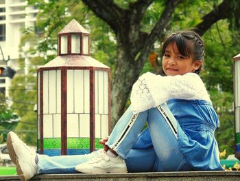 Young woman sitting on bench