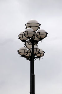 Low angle view of street light against sky